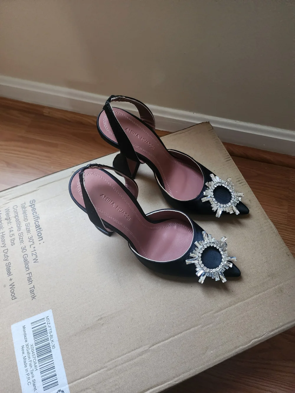 Amina Muaddi Black Satin Pointed Toe Heels with Crystal Sunburst Brooch